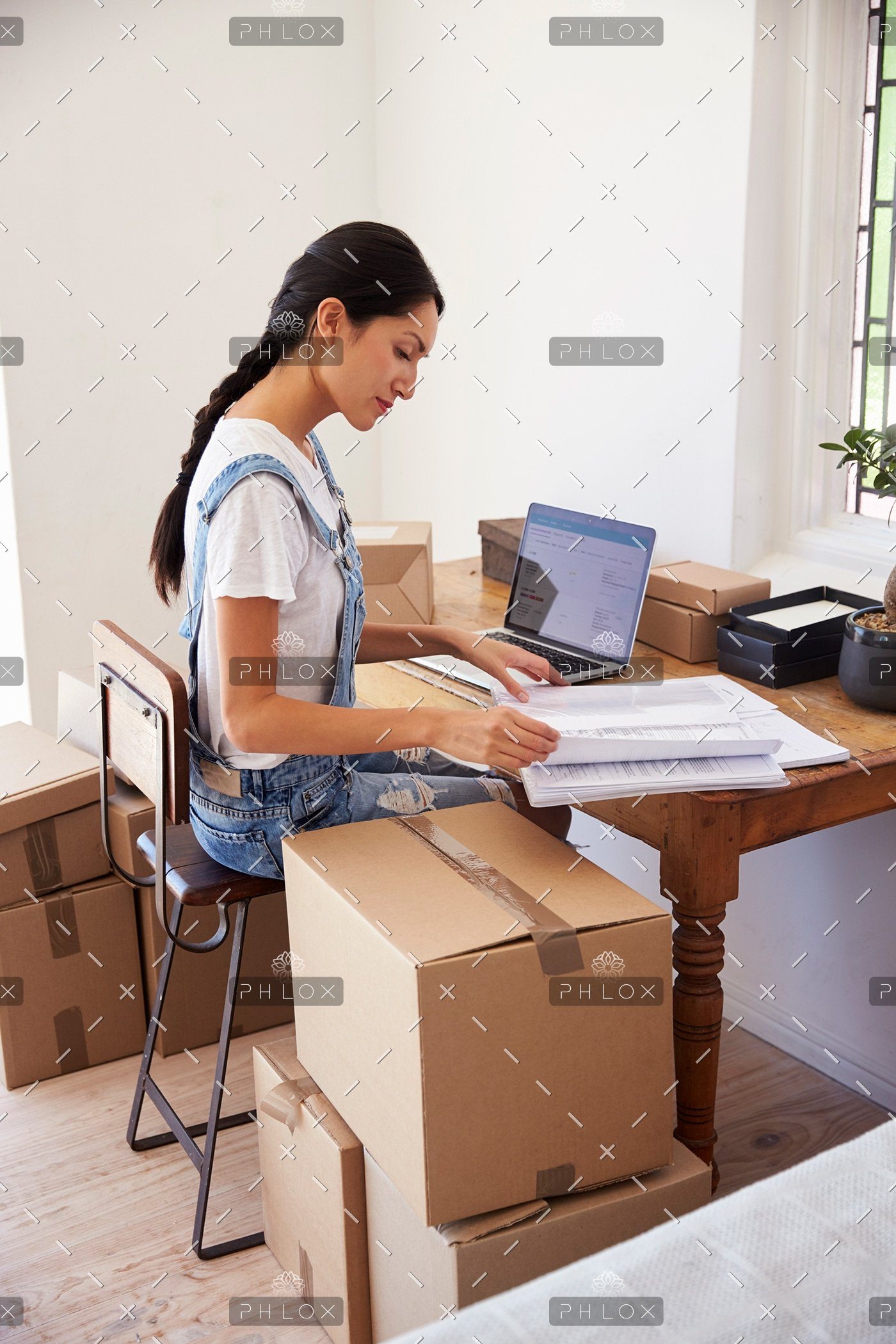 demo-attachment-139-woman-running-business-from-home-working-on-PCZKTN9